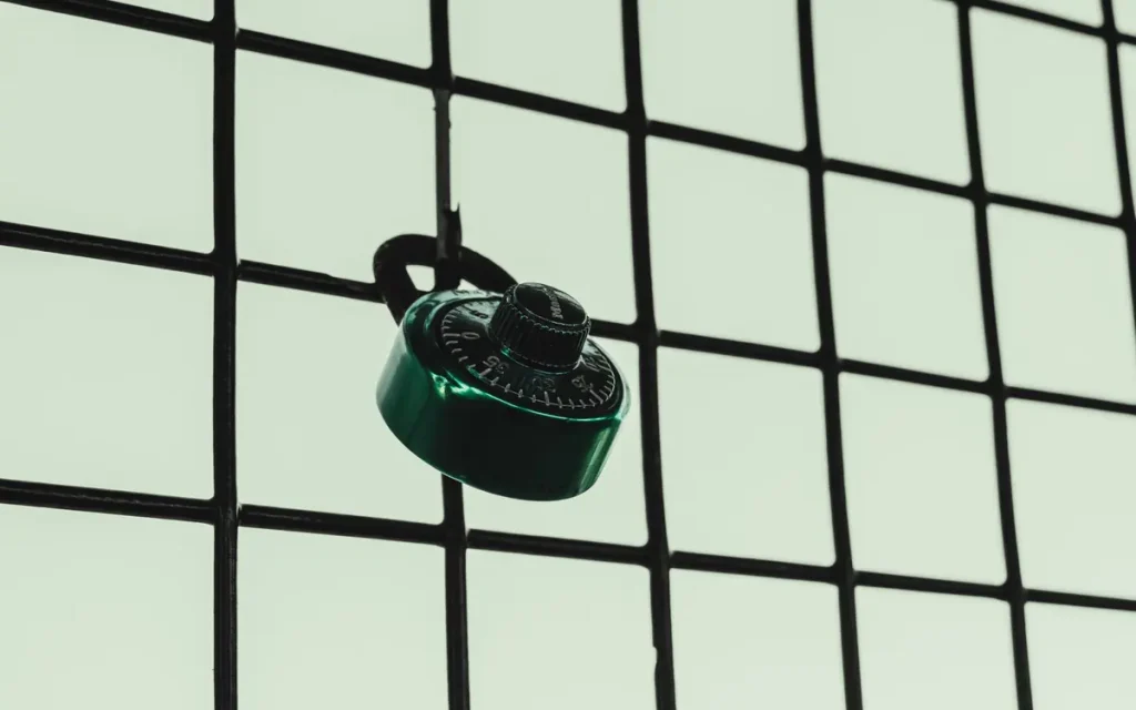 Padlock on a black grid fence, lock service in Auburndale, FL