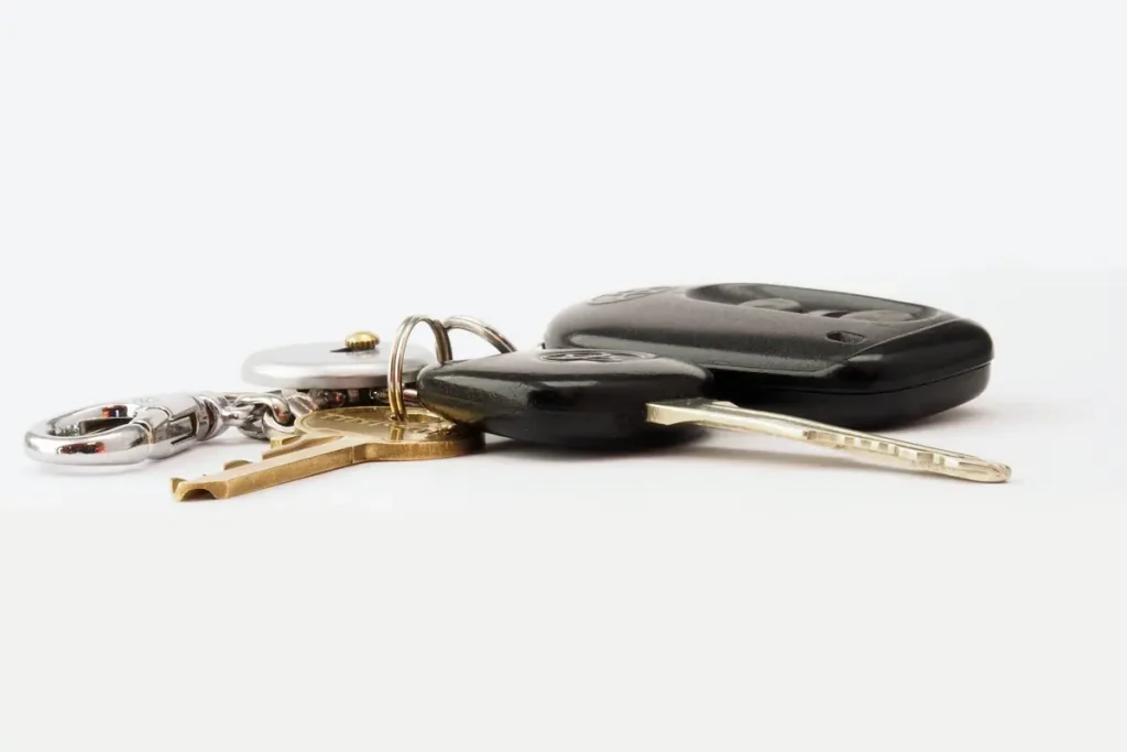 Car keys on a white surface, car key replacement in Lakeland, FL