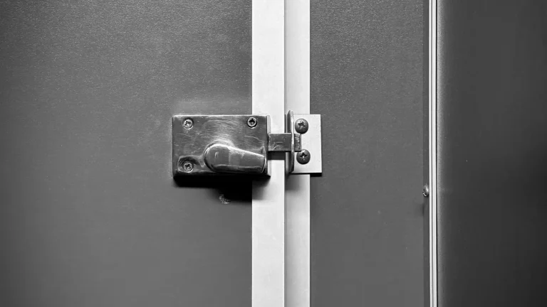 Sliding bolt lock on a grey door, lock installation in Lakeland, FL