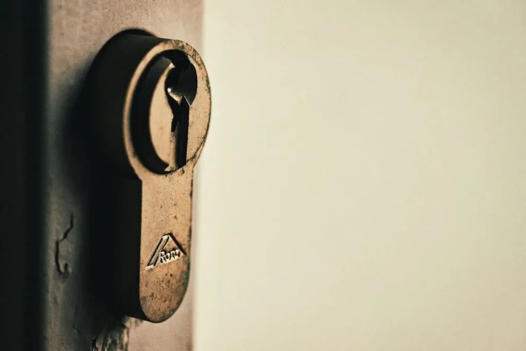 Close-up of a lock cylinder with a key, lock repair