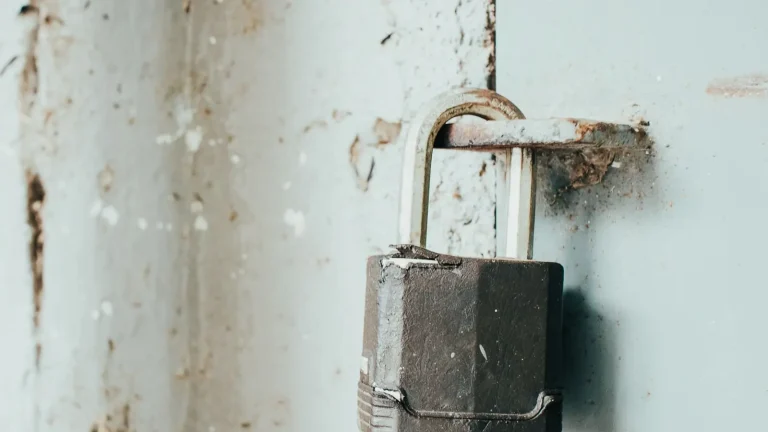 Rusty padlock on a weathered door, lock repair in Lakeland, FL