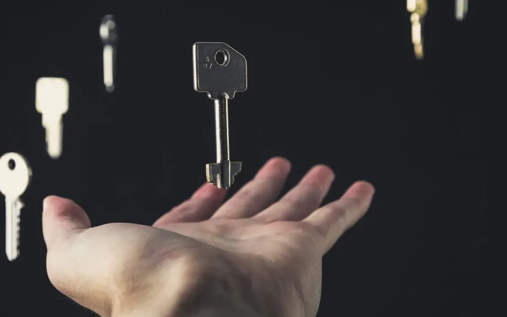 Hand catching keys in mid-air, locksmith service in Lakeland