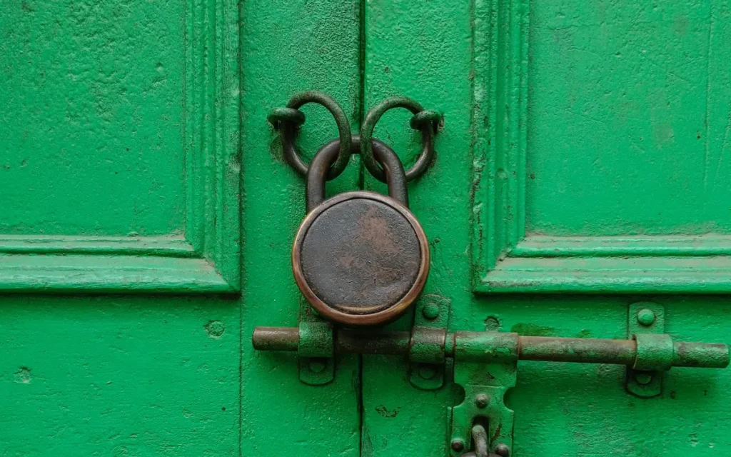 Padlock on a green door, lock service in Polk City, FL