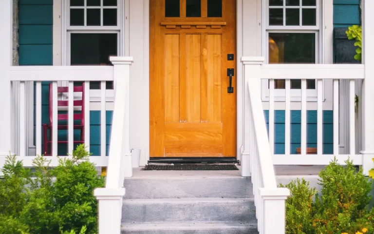 Home with a white porch and dark front door, locksmith in Winter Haven, FL